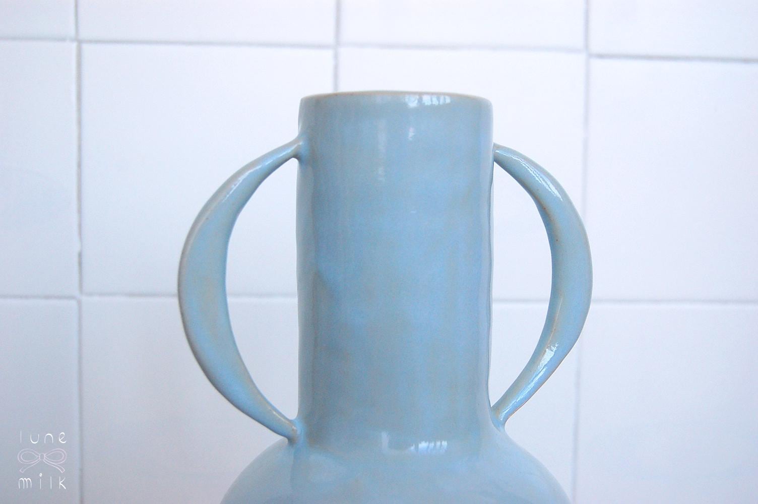 Organic winged ceramic vase natural stoneware glossy pastel blue glaze with semi-circular handles, handmade high temperature