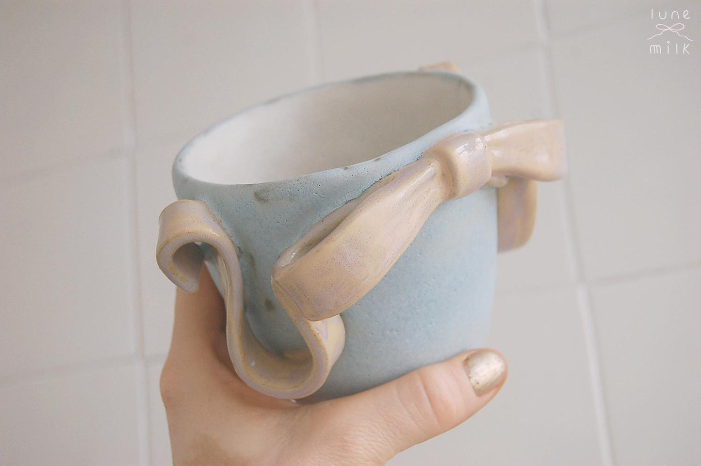 Handmade stoneware ceramic pastel ribbon bow vase, high temperature clay decorated with matte and glossy pastel glaze colors, planter