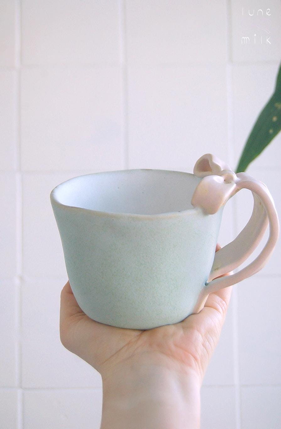 Mug tea and cappuccino organic natural bow stoneware light turquoise with pink bow handles, pastel matte glazes, L size