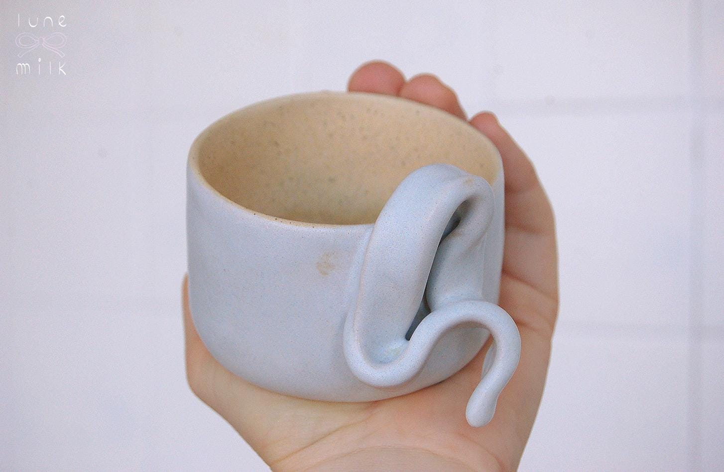 Mug cappuccino organic natural stoneware pastel blue and speckled sand color glazes, handmade wheel thrown with ribbon handle