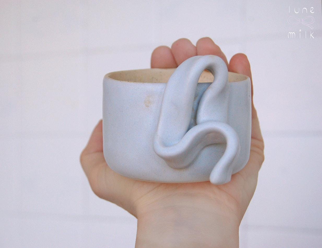 Mug cappuccino organic natural stoneware pastel blue and speckled sand color glazes, handmade wheel thrown with ribbon handle