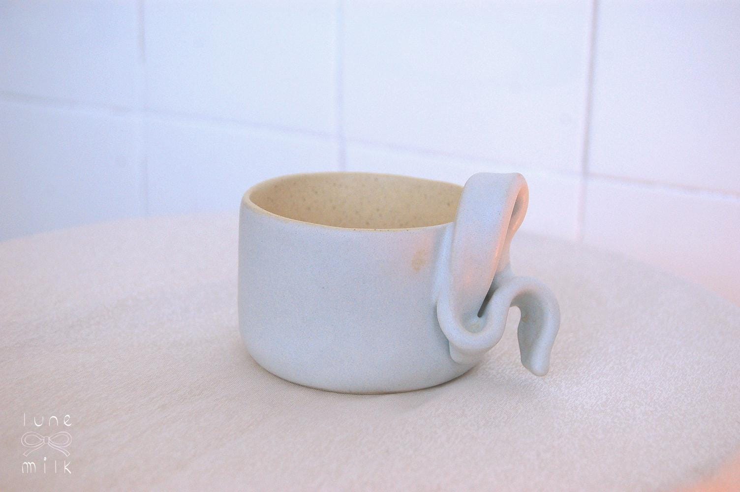 Mug cappuccino organic natural stoneware pastel blue and speckled sand color glazes, handmade wheel thrown with ribbon handle