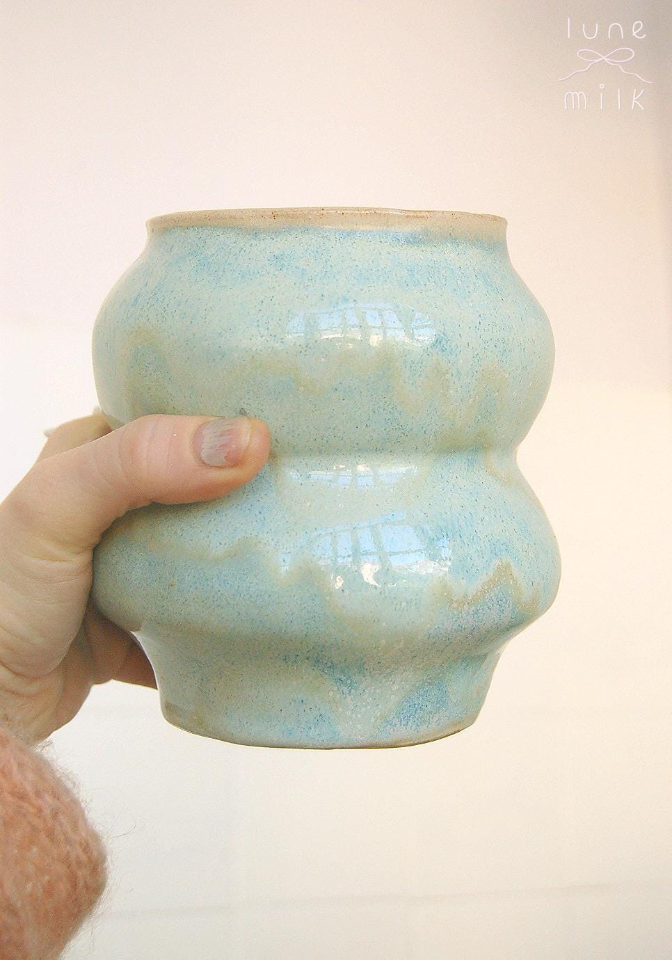 Organic wavy ceramic vase natural stoneware pastel ice blue turquoise variegated and speckled cream glossy glaze, handmade high temperature