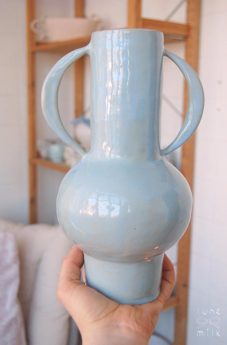 Organic winged ceramic vase natural stoneware glossy pastel blue glaze with semi-circular handles, handmade high temperature