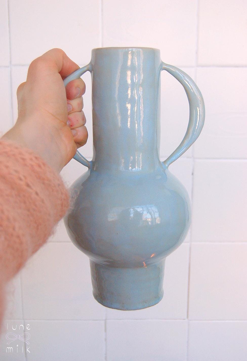 Organic winged ceramic vase natural stoneware glossy pastel blue glaze with semi-circular handles, handmade high temperature