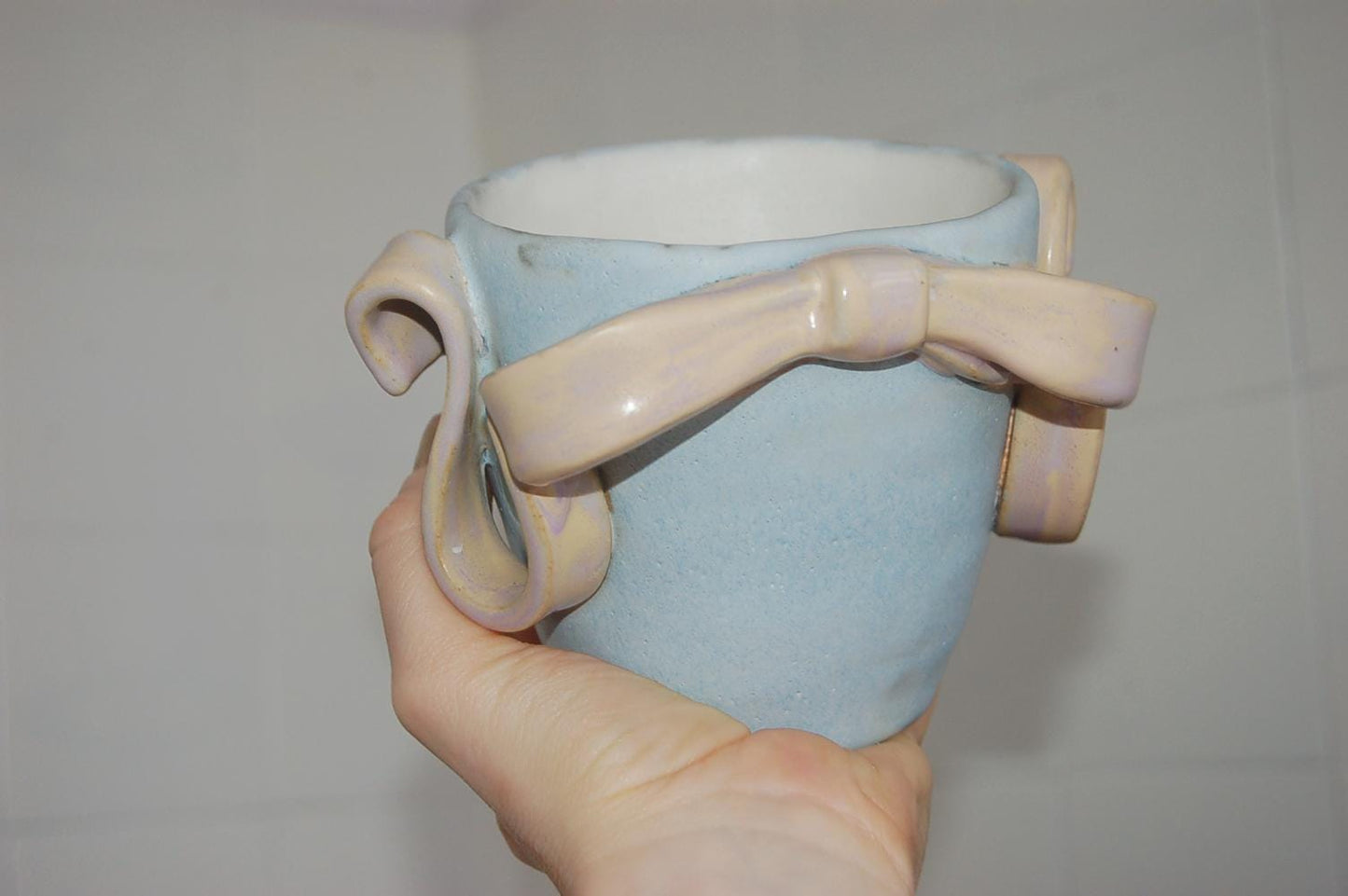 Handmade stoneware ceramic pastel ribbon bow vase, high temperature clay decorated with matte and glossy pastel glaze colors, planter