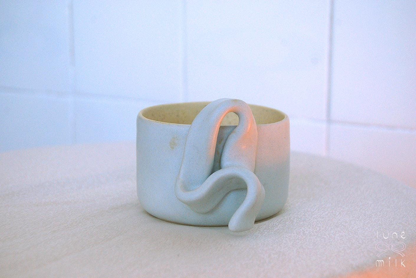 Mug cappuccino organic natural stoneware pastel blue and speckled sand color glazes, handmade wheel thrown with ribbon handle