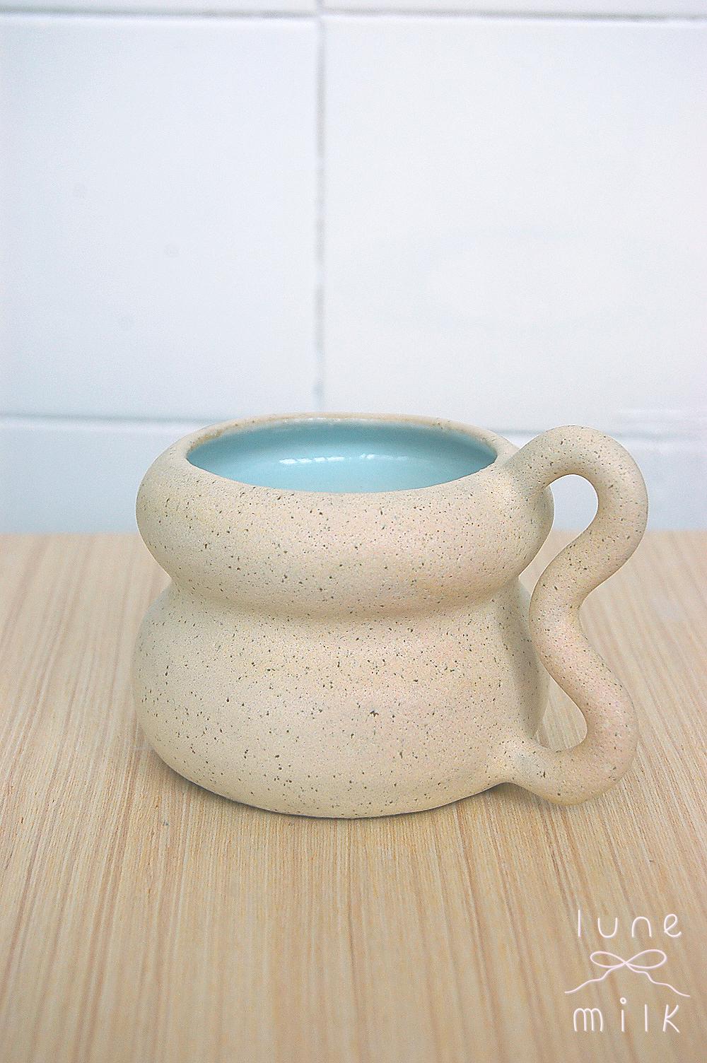 Ceramic Mug cappuccino organic natural stoneware almond milk and pastel blue color glazes, handmade wheel thrown with wavy handle