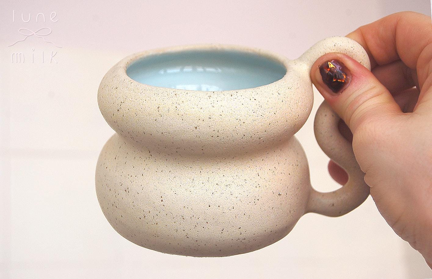 Ceramic Mug cappuccino organic natural stoneware almond milk and pastel blue color glazes, handmade wheel thrown with wavy handle